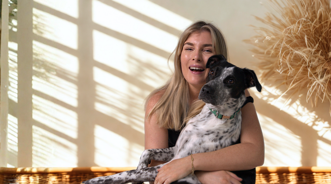 Girl hugging dog with Oh Vienna Collar
